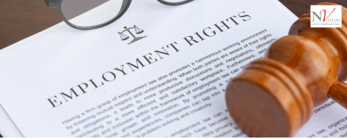 A gavel found in a law court placed on top of a document which has the heading 'employment rights'